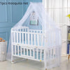 White mosquito net crib and bed with a protective canopy