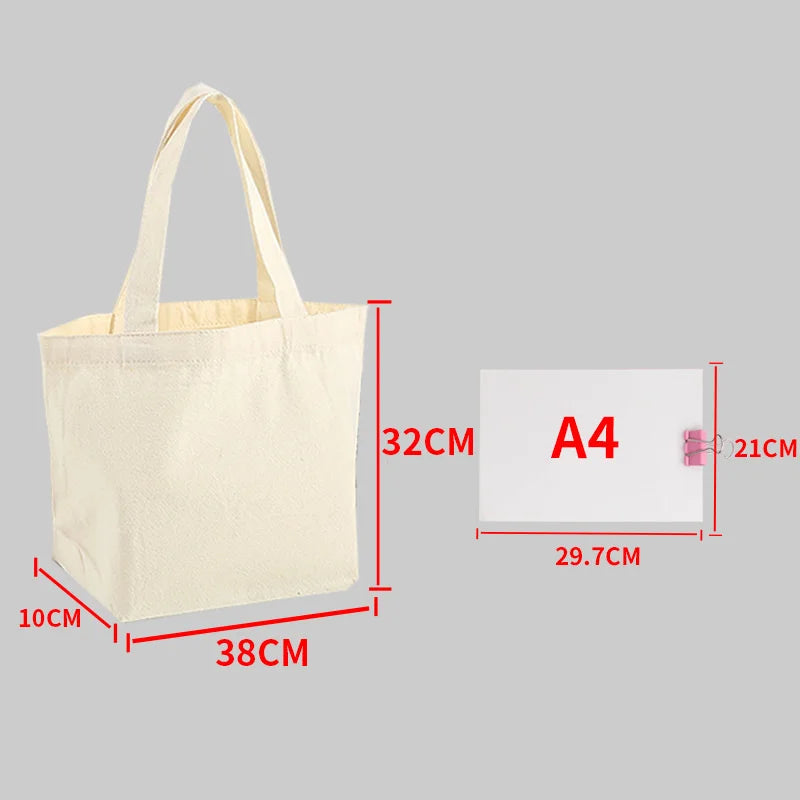 A beige canvas tote bag shown with dimensions, including a size card labeled A4.