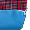 Blue waterproof mealtime bib with a red and black plaid fabric pattern.