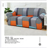 A modern sofa and chair slipcover featuring a patchwork pattern of gray, orange, and black checkered fabric.