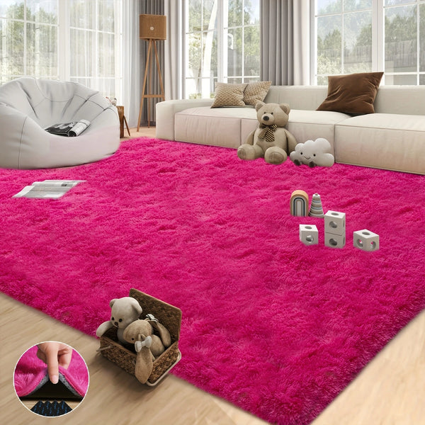 A vibrant pink shaggy plush area rug placed on a light wood floor in a bright living room setting.