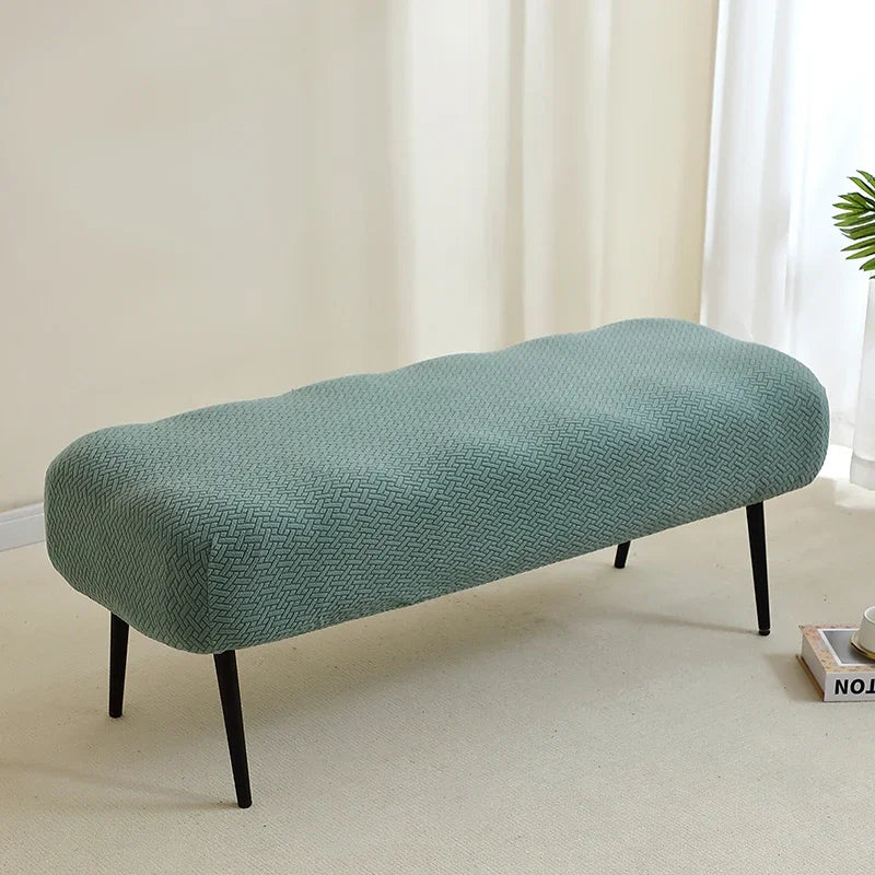 A light sage green elastic jacquard bench cover used as a seat for piano, dining, or entryway.