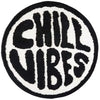 A round black and white fuzzy mat featuring the text CHILL VIBES in a distressed letter pattern.