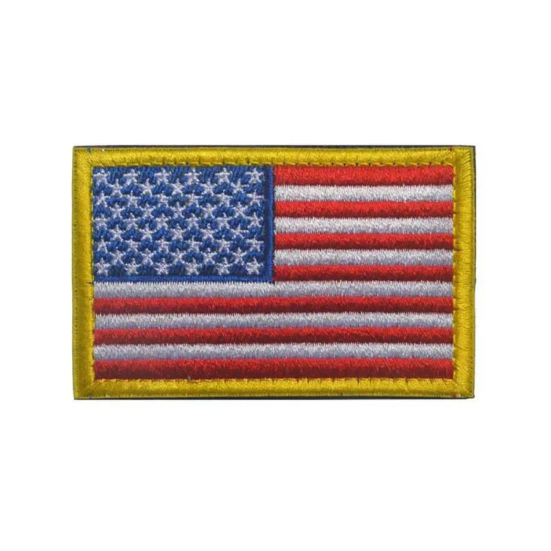 A rectangular patch featuring the design of the American flag with a gold border and hook and loop backing.
