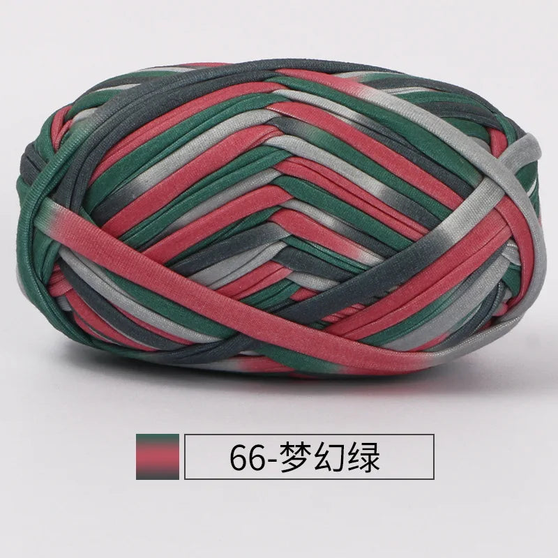 A ball of hand-dyed fabric strip yarn featuring stripes of red, green, and gray.