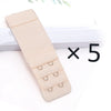 Five beige adjustable bra extender straps laid out on a white surface.