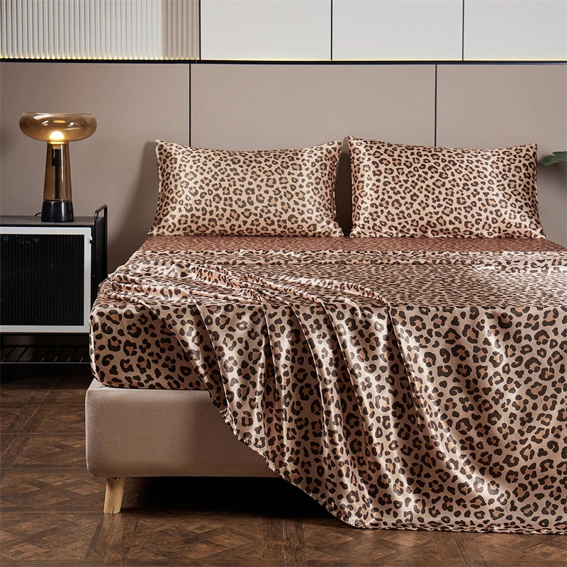A leopard print satin bed sheet set displayed on a bed with neutral tones and modern decor.