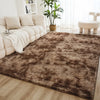 A brown shaggy rug is placed on a light wood floor in a bright living room setting.