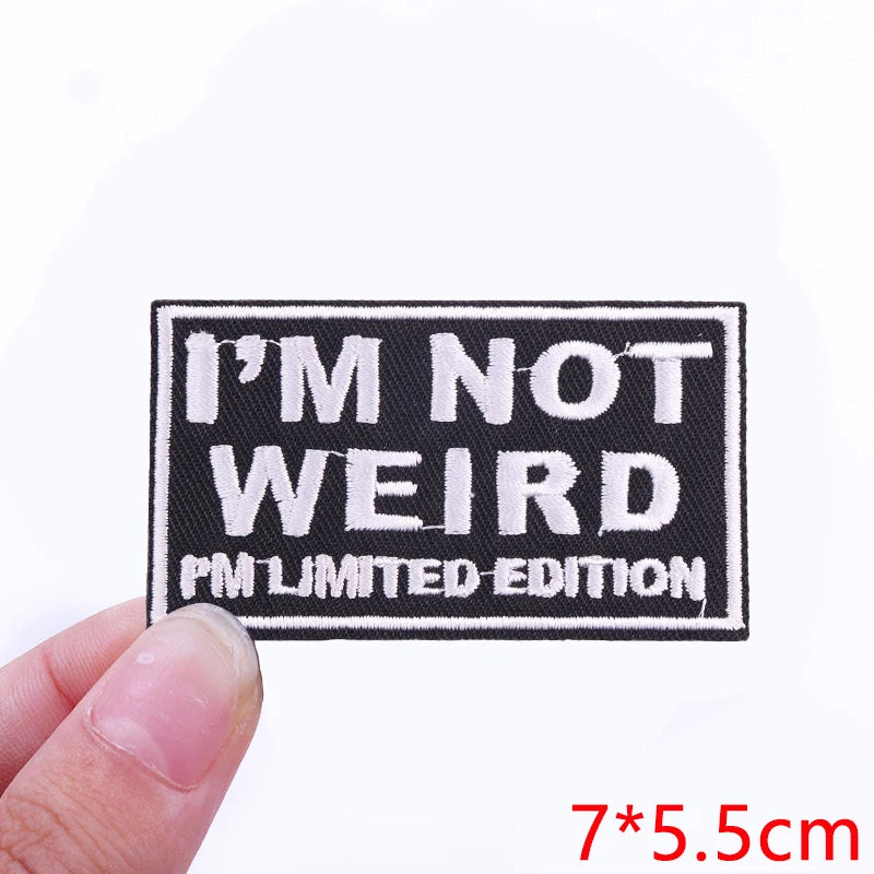 Black embroidered patch with white text I'M NOT WEIRD and PM LIMITED EDITION