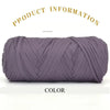 A skein of thick purple polyester blended yarn is shown rolled up for crafting.