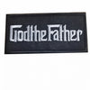 Black embroidered patch with the text GodtheFather in white script.