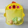 A yellow organizer bag for bath toys featuring a cute face design and a mesh net.