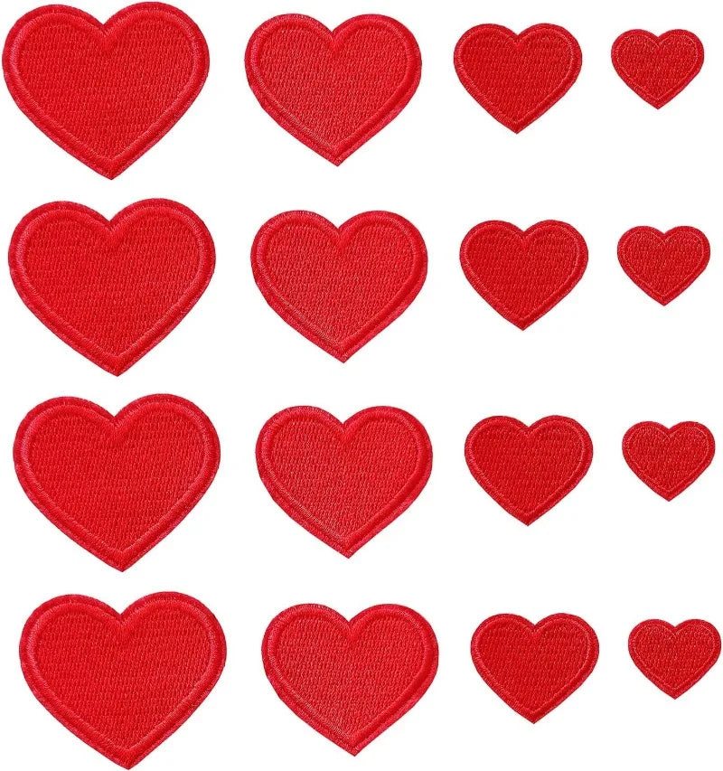 A collection of 24 iron-on love heart embroidered patches in red.