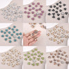 A collection of flower-shaped resin button rhinestones in various colors and sizes.