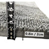 Close-up of a gray chenille pet door mat showing a ruler for scale and a measurement of 0.8in / 2cm.