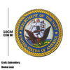 Embroidered patch featuring the Department of the Navy seal and United States of America text on a gold fabric background