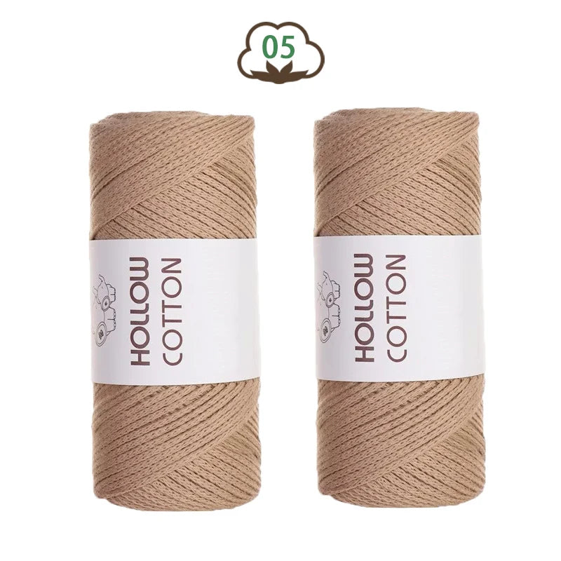 Two spools of light beige hollow cotton yarn for crafting