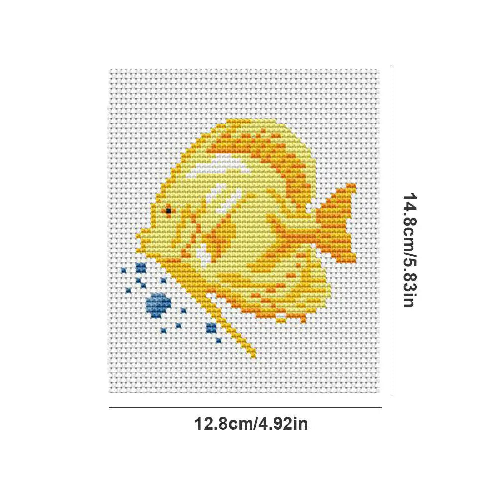 A cross stitch design of a yellow fish with blue accents on a white background.
