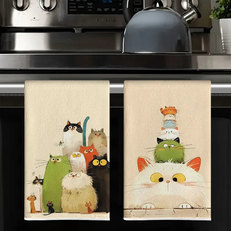 A set of two watercolor-style kitchen towels featuring various cats in natural tones.