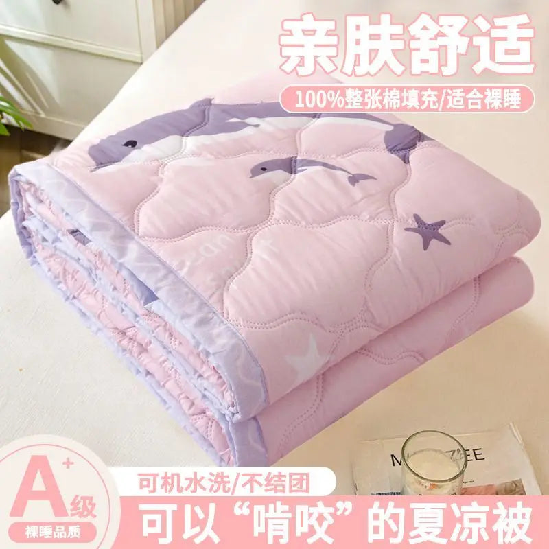 Pink quilted blanket designed for dorm life and breathable comfort