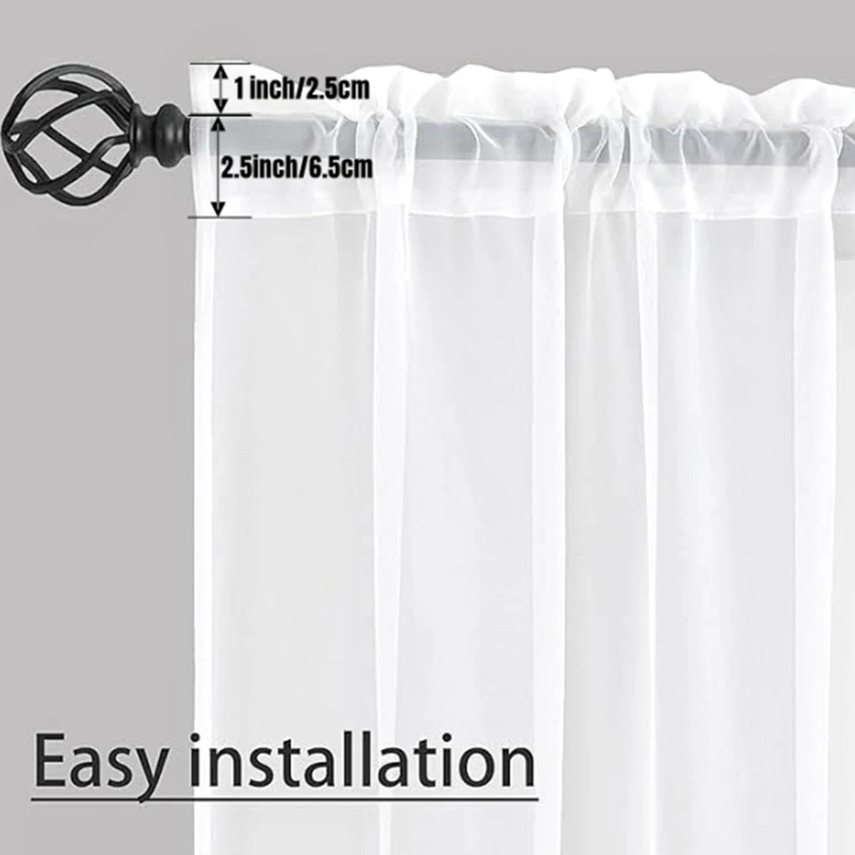 A set of sheer white voile curtains with a black mounting bracket and measuring lines.