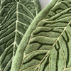 Close-up of a textured green plant design hand towel leaf.