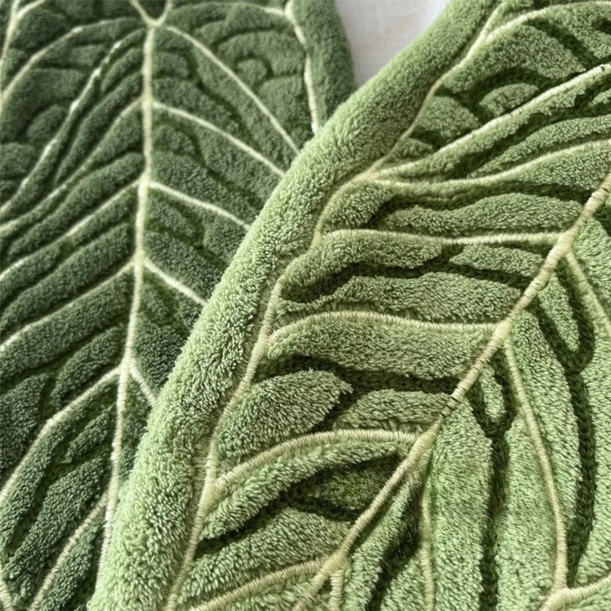 Close-up of a textured green plant design hand towel leaf.