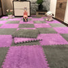 A purple and gray interlocking puzzle rug mat featuring a checkered pattern with small plush figures.