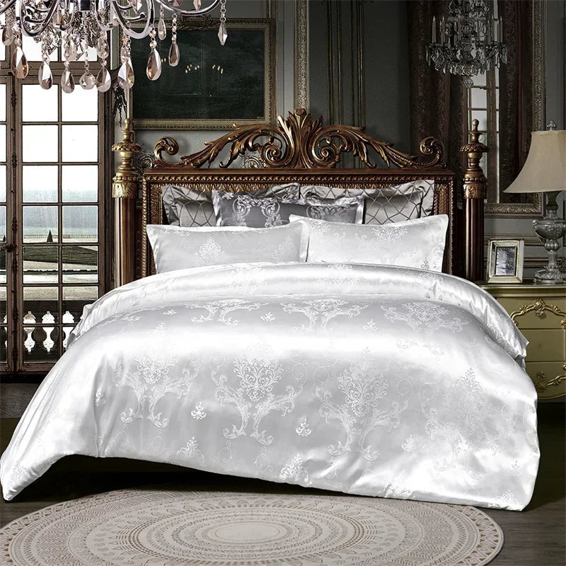A luxurious white satin duvet cover set displayed on a dark wood bed with ornate headboard and antique lighting.