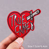 Red heart shaped embroidered patch featuring the text True Crime and a knife