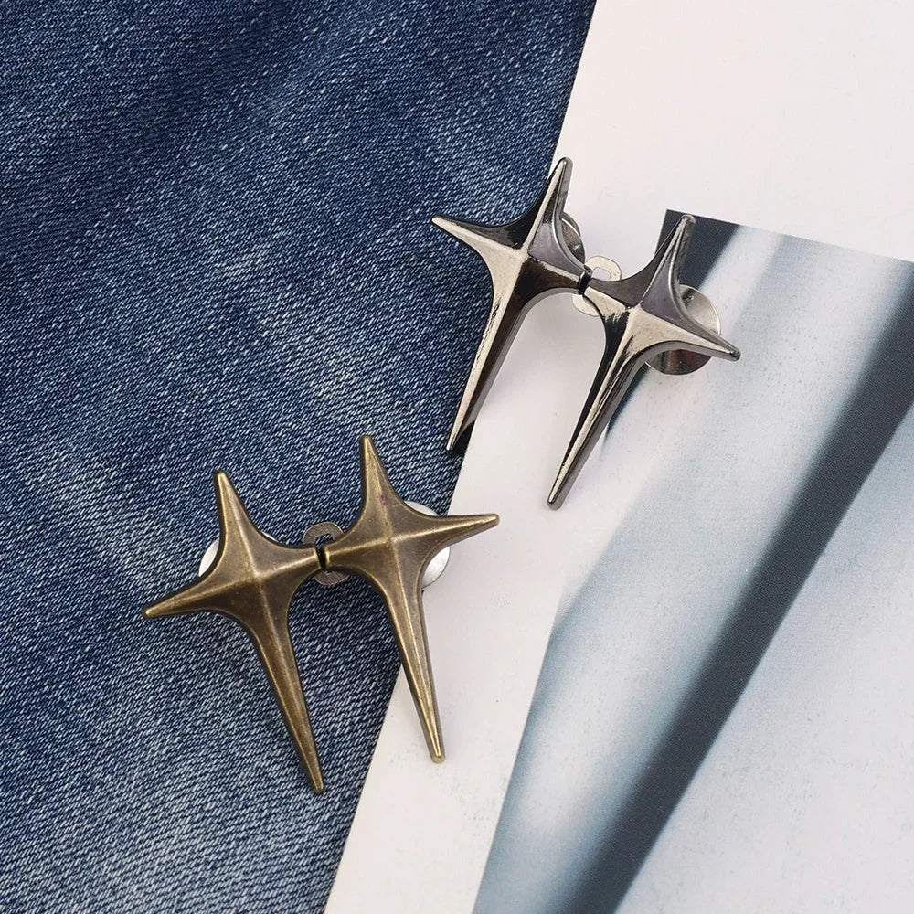 Two gold-toned Y2K star clips for fastening jeans or skirts