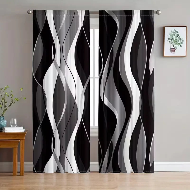 A set of two abstract wavy line curtains in black and white featuring light-filtering rod pocket panels.