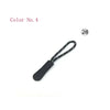 Black replacement zipper pulls with a black cord and small white dots.