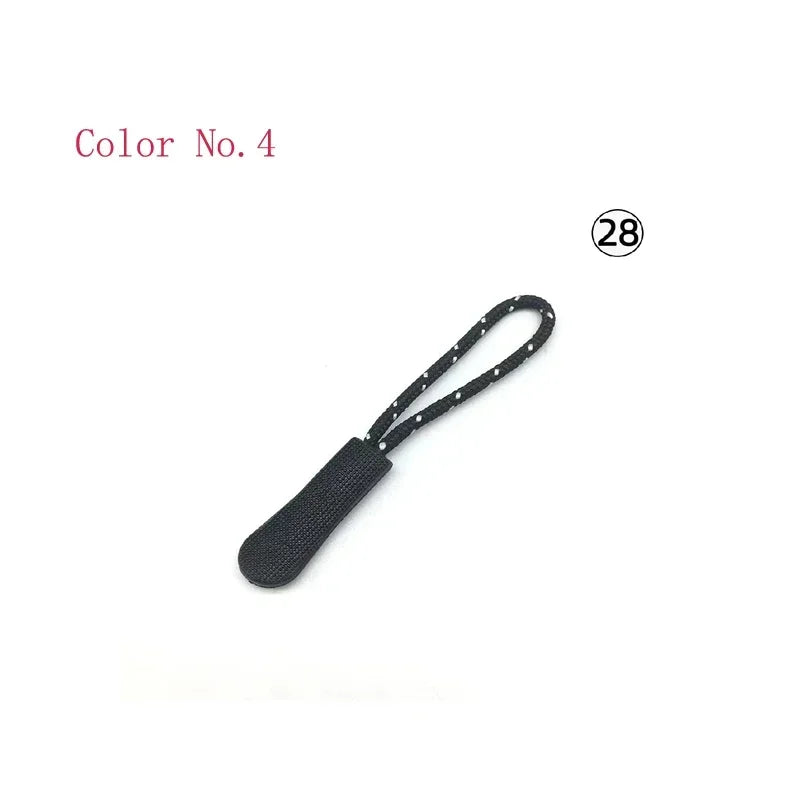Black replacement zipper pulls with a black cord and small white dots.