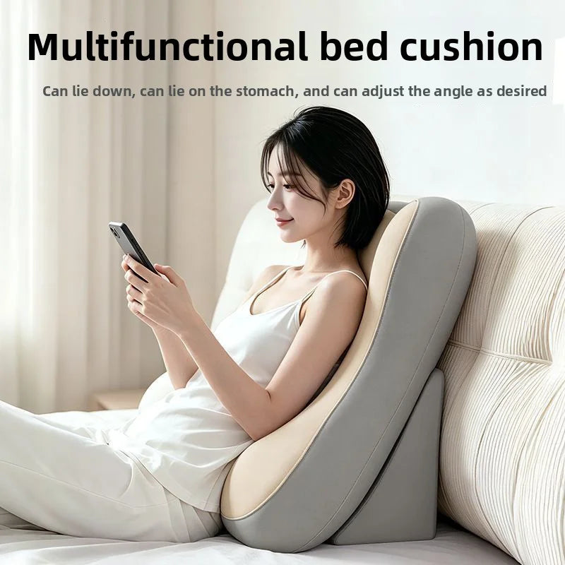 A woman is using a multifunctional bed cushion to adjust the angle while holding a smartphone.