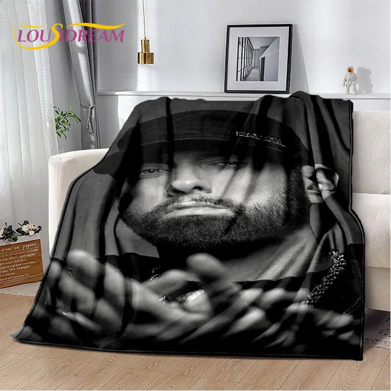 A black and white vintage-inspired graphic throw blanket featuring a close-up portrait of a man.