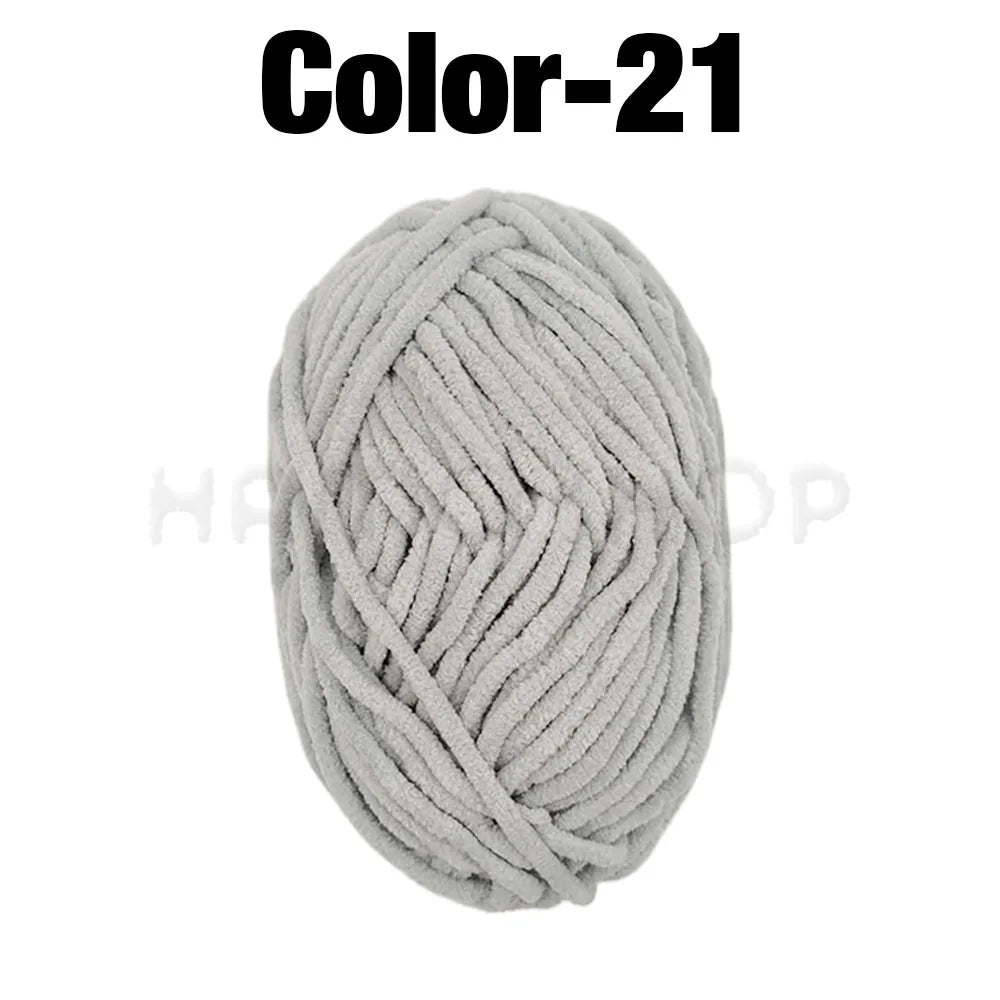 A ball of light gray soft velvet chenille yarn for crafting.