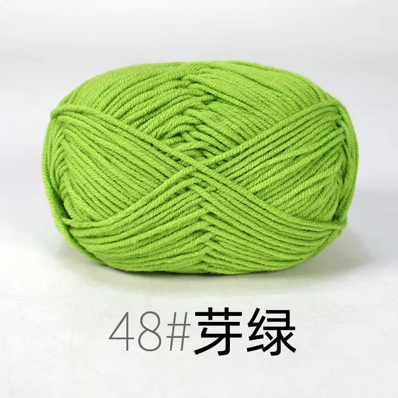 A ball of bright lime green 4ply knitting yarn for crafts.