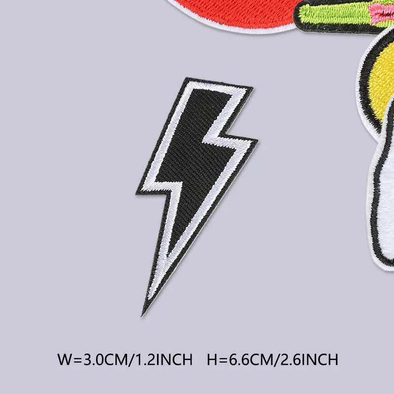 A black lightning bolt embroidered patch on a light gray background.
