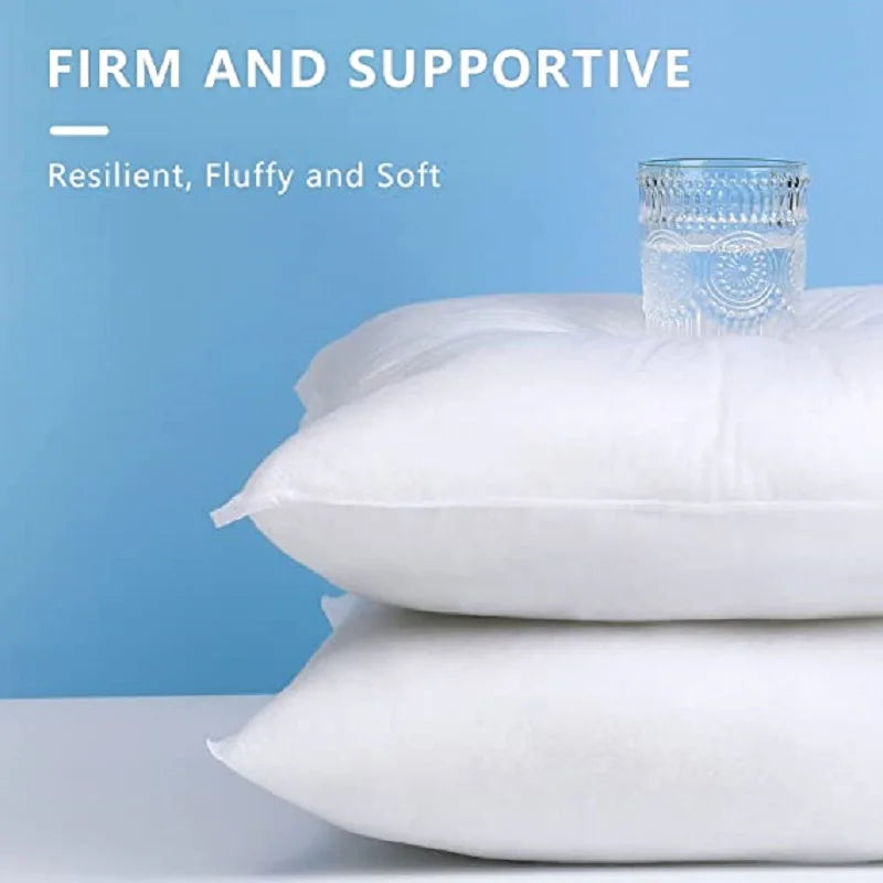 White pillow inserts showing resilience and fluffiness with a glass jar for comparison.