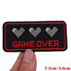 Black embroidered patch with the text GAME OVER and three heart icons on a black fabric background