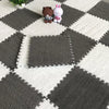 A gray and white checkered rug mat with a square section cut out, featuring two plush animal figures.
