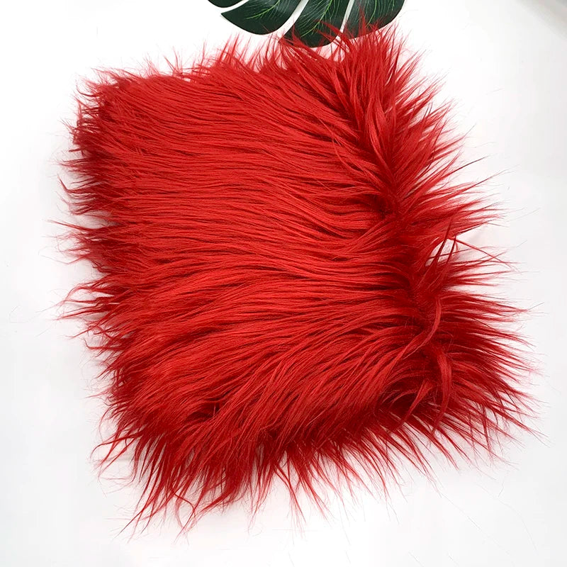 A vibrant red faux fur plush fabric used for sewing and crafting.
