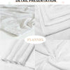 Detail presentation of white flannel patchwork throw blankets folded and displayed.