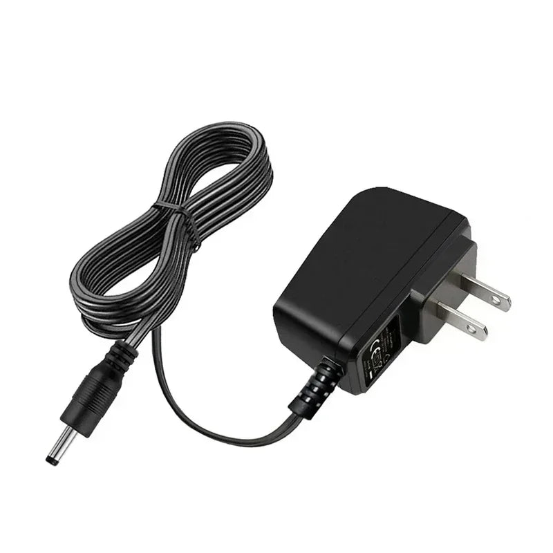 Black portable handheld sewing machine with a coiled cord and power plug.