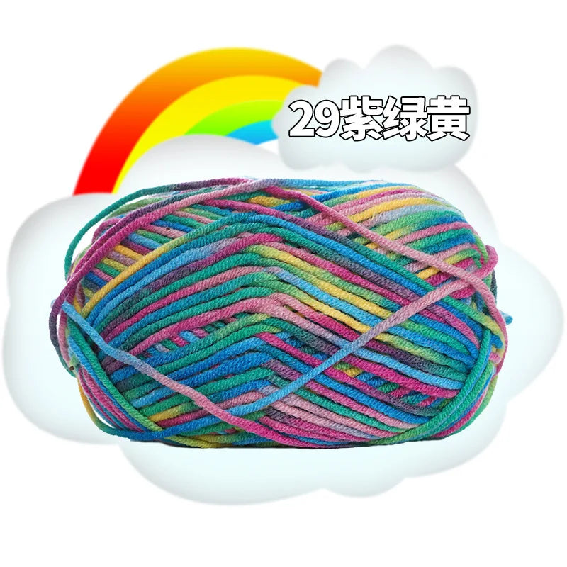 A ball of multi-colored yarn is shown inside a white cloud with a rainbow in the background.