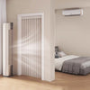 A vertical, light-colored foldable door curtain is shown installed in a white door frame, next to a bedroom with a window-mou