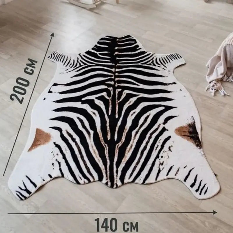 A rectangular rug featuring a black and white zebra print on a white background.