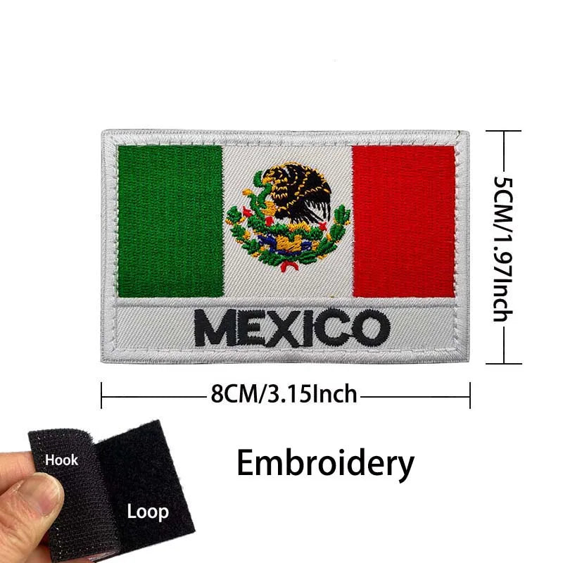 A rectangular embroidered patch featuring the Mexican flag design with an eagle emblem on a gray background.