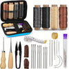 A kit of professional leather crafting tools including waxed thread spools, needles, and various stitching implements.